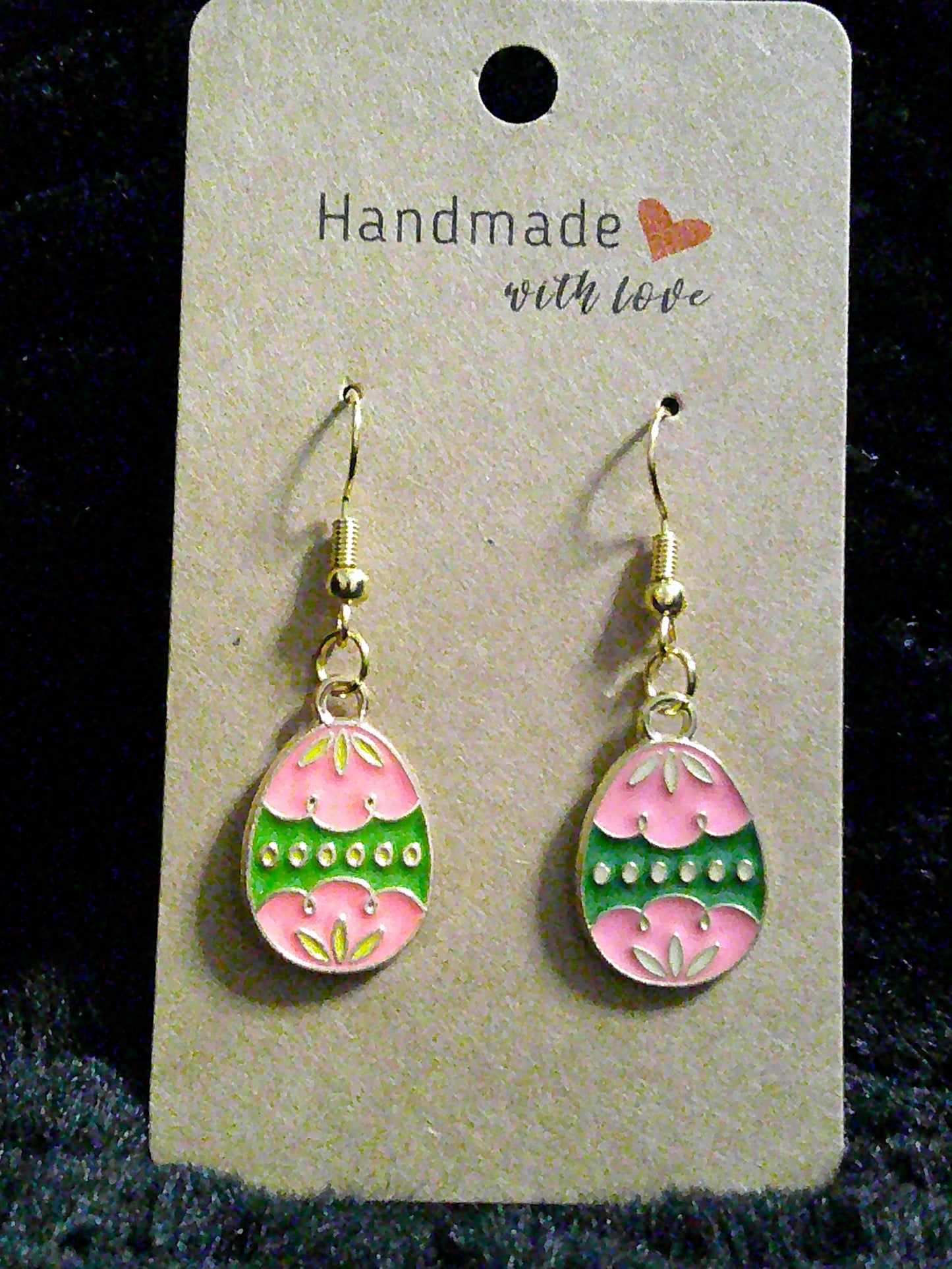 Pink egg with green stripe