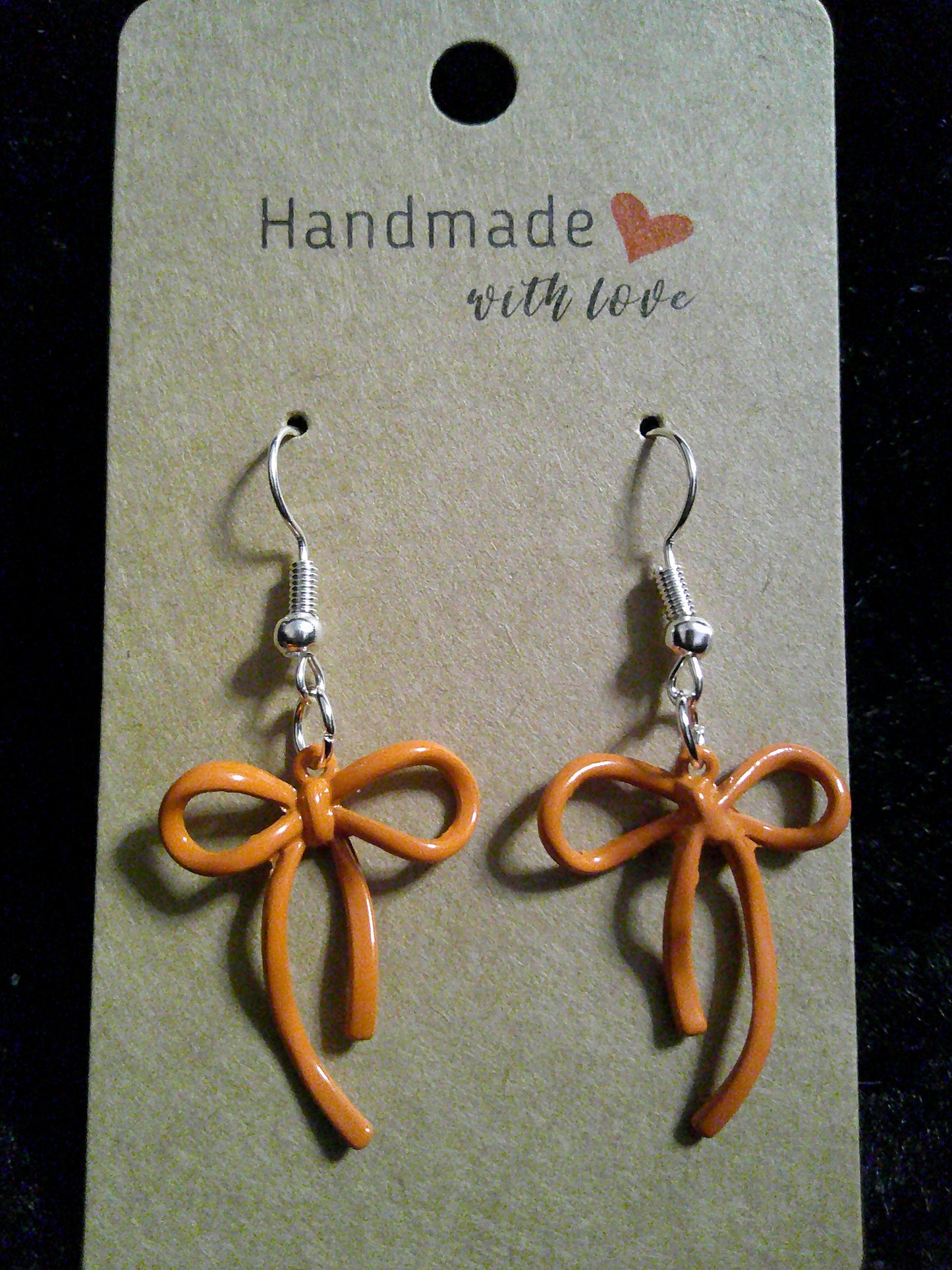 Orange bow on silver