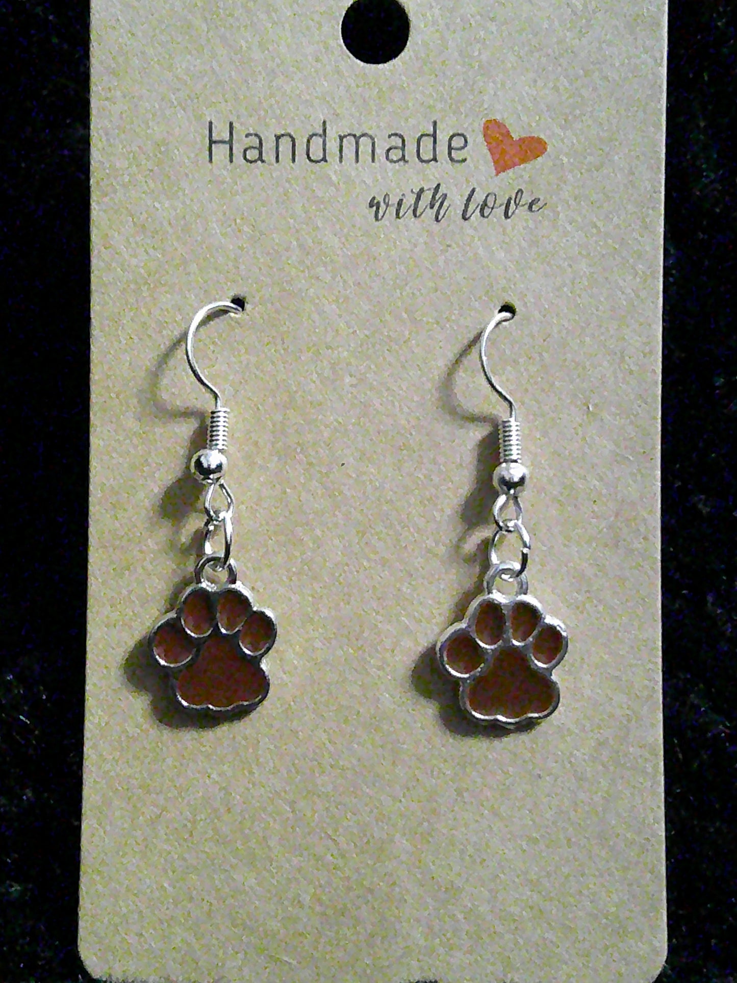 small brown paw on silver