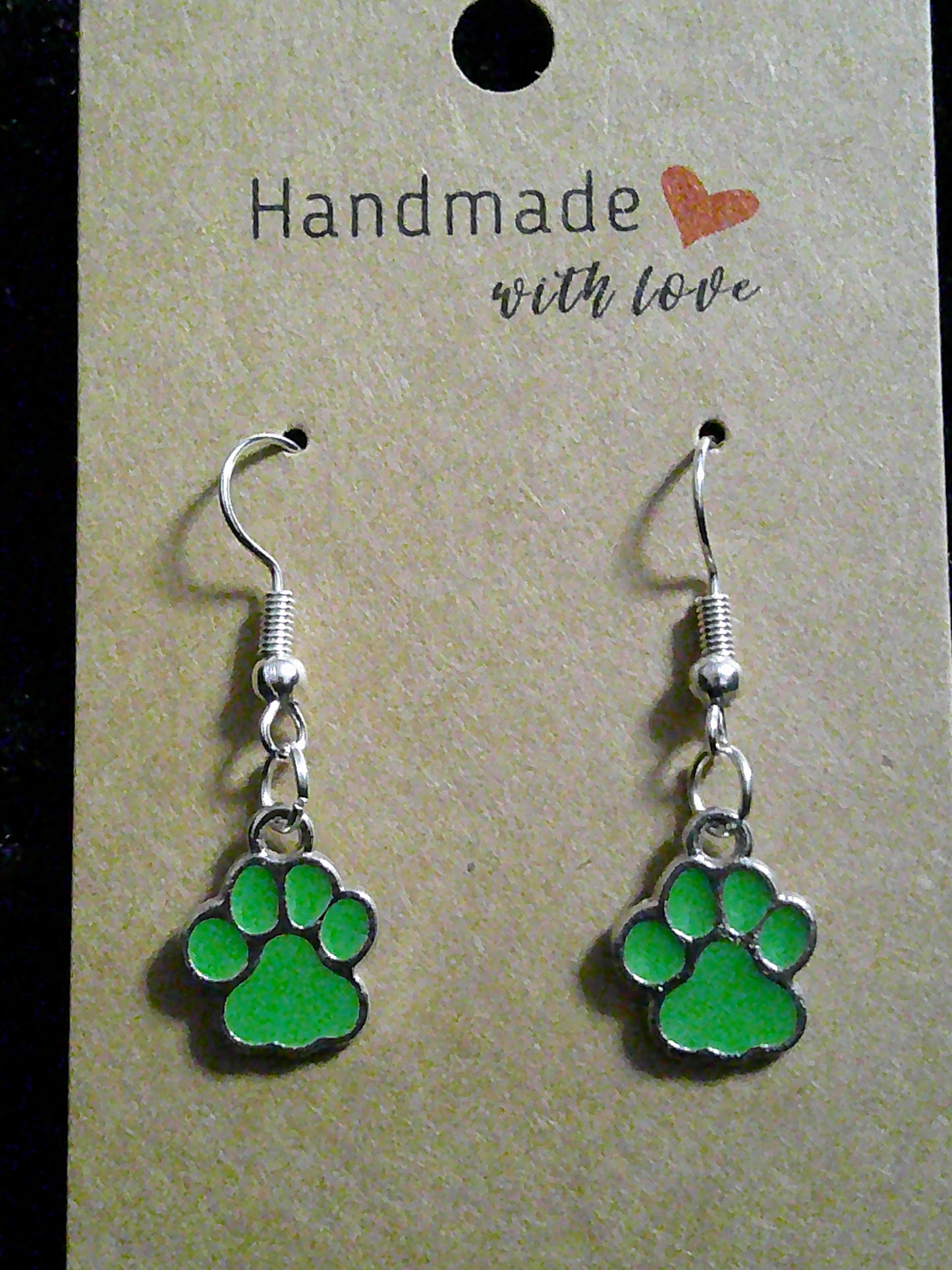 small green paw on silver